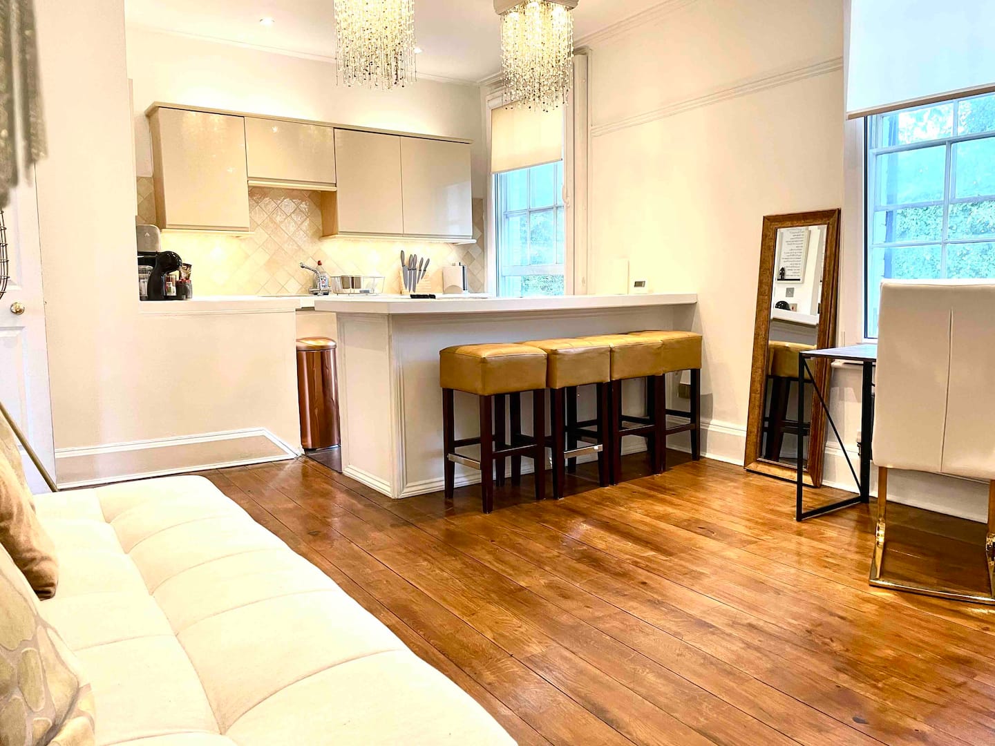 Contemporary interior with large windows and park view over Jesus Green