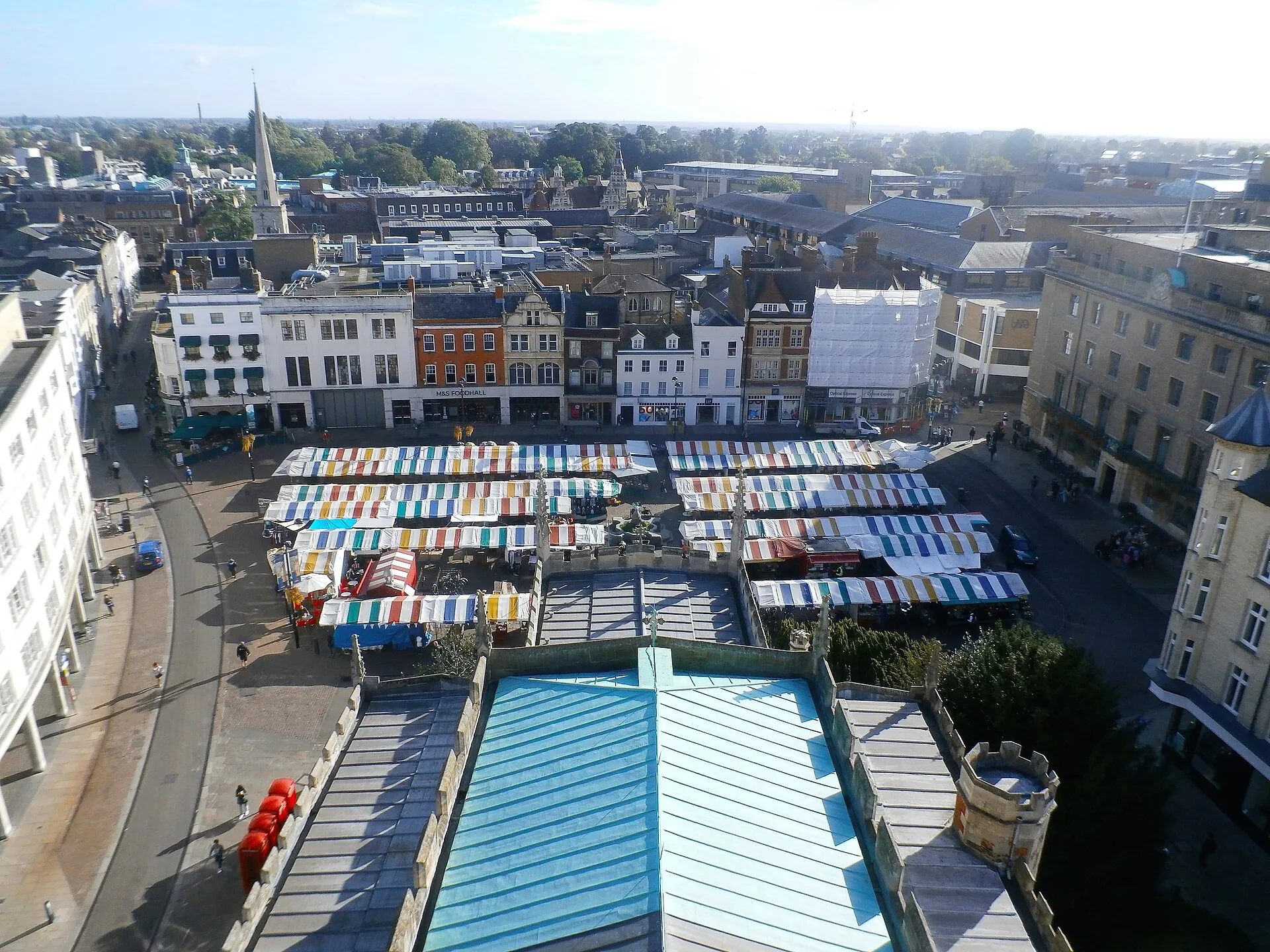 Market stalls filling Cambridge Market Square, England, viewed from above