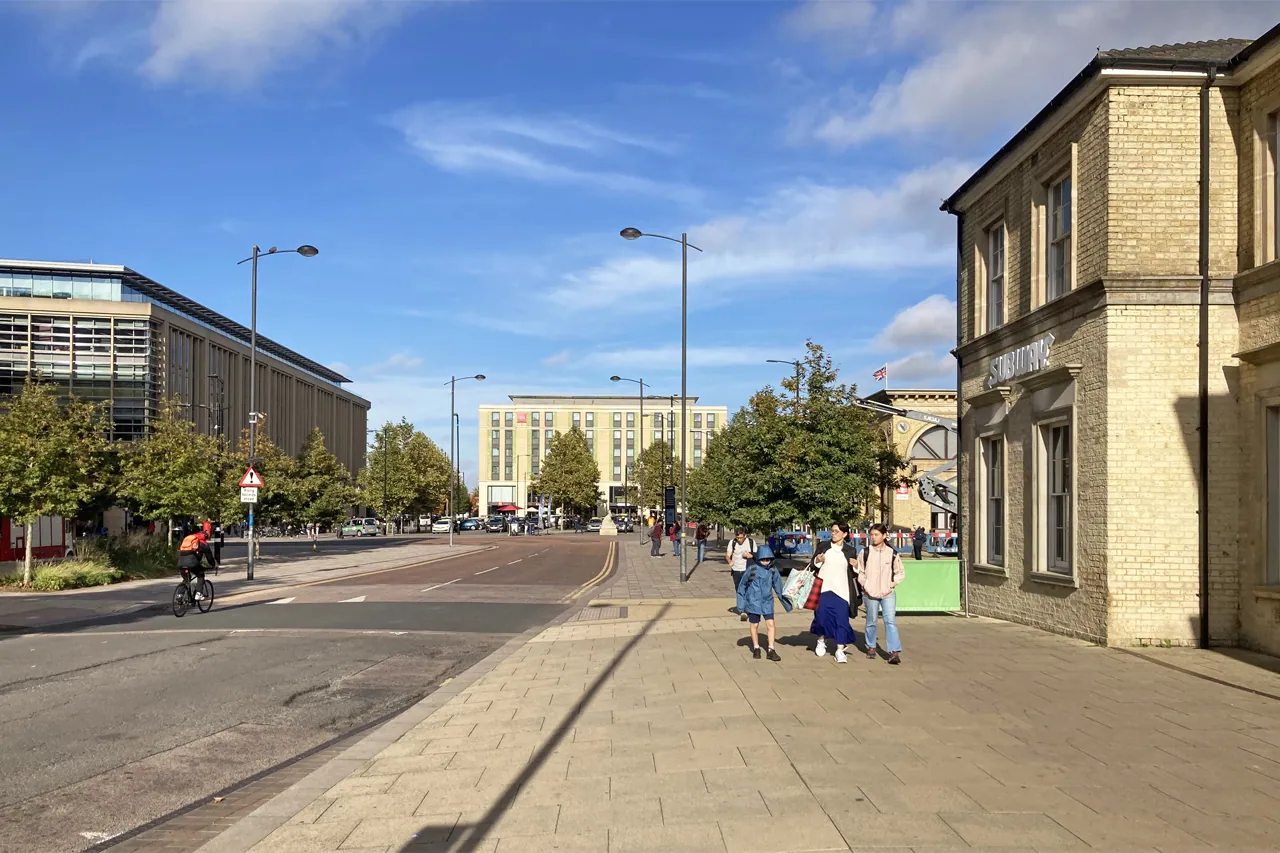 Modern buildings, cycle lanes and street trees at Station Square beside Cambridge railway station, England